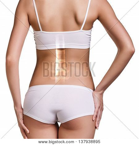 Digital composite of highlighted spine of woman with back pain