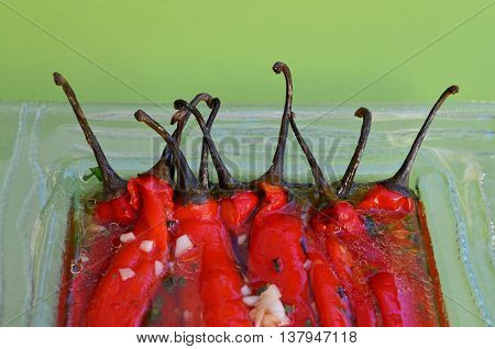 Sour salad of red peppers and garlic in marinade