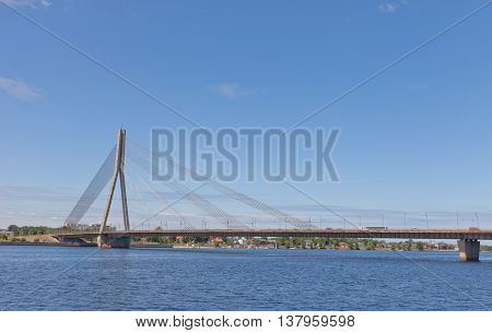 RIGA LATVIA - JUNE 7 2016: Vansu Bridge (1981 former Gorky Bridge) over Daugava River in Riga Latvia. One of five big bridges in Riga and the only cable-stayed