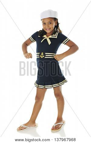 A pretty young sailor girl smiling at the viewer with a 