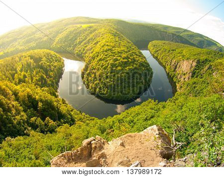 Vltava river horseshoe meander with green forest. View from Maj vantage point near Prague in central Bohemia, Czech republic