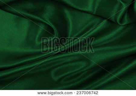 Smooth Elegant Green Silk Or Satin Luxury Cloth Texture As Abstract Background. Luxurious Background