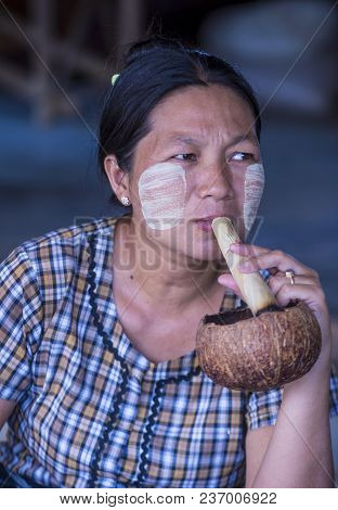 Bagan, Myanmar- Sep 04 : Woman Smoking A Cheroot Cigar In Market In Bagan, Myanmar On September 04, 