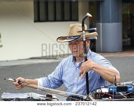 Kaohsiung, Taiwan -- February 16, 2018: A Street Musician Plays The Erhu, A Two-stringed Chinese Fid