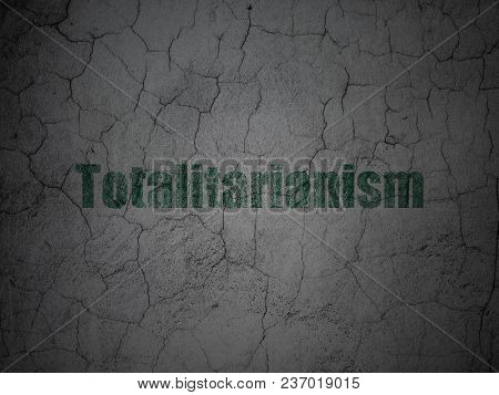 Political Concept: Green Totalitarianism On Grunge Textured Concrete Wall Background