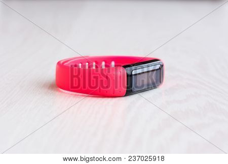 Pink Fitness Bracelet With Place For Text On White Wooden Background