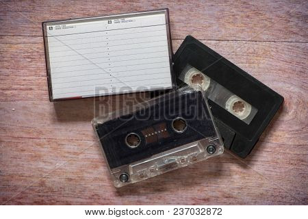 Old Cassette Tapes With A Wooden Background