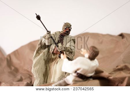 APR 17 2018: Recreation of a scene from Star Wars A New Hope; Luke Skywalker is attacked by a Tusken Raider on the desert planet of Tattooine - Hasbro Black Series 6 inch action figures