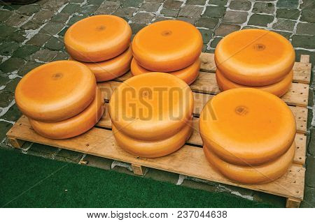 Gouda, Southern Netherlands - June 29, 2017. Close-up Of Cheeses Stacks For Sale At The Market Squar