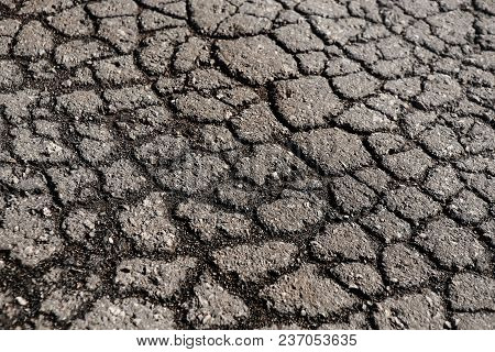 Lot Of Cracks On The Old Asphalted Road