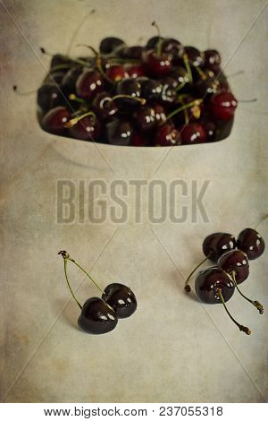 Beautiful Juicy Fresh Summer Cherries In A White Bowl On A Vintege Background