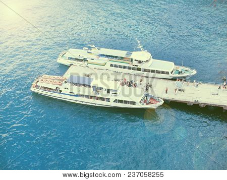 The Sea Is Blue. An Old Boat Is Transporting People.