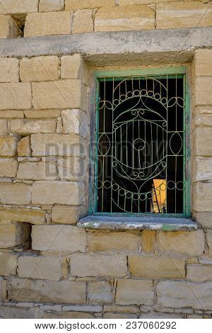 Typrical Window With Metal Patterned Grill In An Old House.
