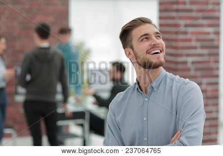 Cheerful man smiling  in office.