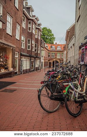 S-hertogenbosch, Southern Netherlands - July 01, 2017. Several Bikes Stopped At The Alley Entrance I