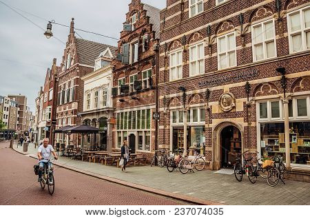 S-hertogenbosch, Southern Netherlands - July 01, 2017. Street With Restaurants, Shops, Cyclist And P