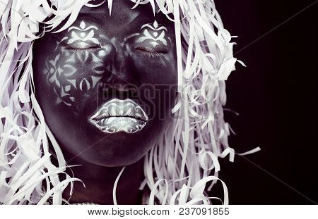 Creative Make Up Like Ethiopian Mask, White Pattern On Black Face Close Up, Halloween Horror