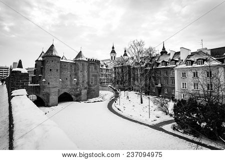 Warsaw Barbacan Fortress Castle In Winter Is In The Capital City Of Poland. Old Town Is The Historic