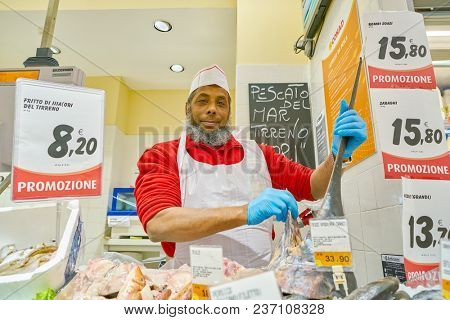 ROME, ITALY - CIRCA NOVEMBER 2017: indoor portrait of staff in Conad supermarket in Rome.