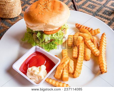 Beef Burger With French Fries, Ketchup And Mayonnaise On White Plate. Rich Nutrititive Breakfast. Am