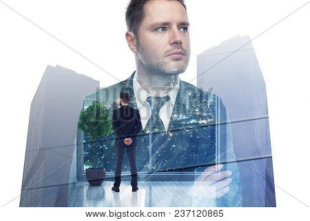 Businessman Looking Out Of Window In Abstract Interior With Night City View. Employment And Tomorrow