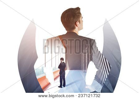 Businessman Looking Out Of Window In Abstract Interior With City View. Employment And Future Concept