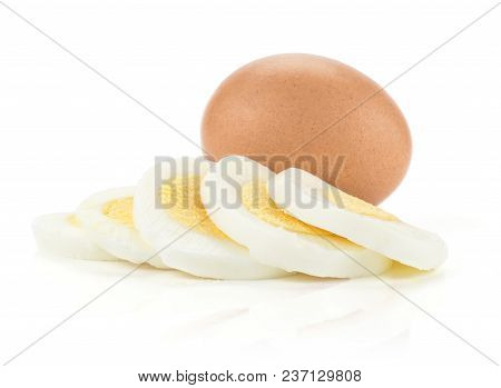 One Boiled Brown Chicken Egg And One Cut In Five Slices Isolated On White Background