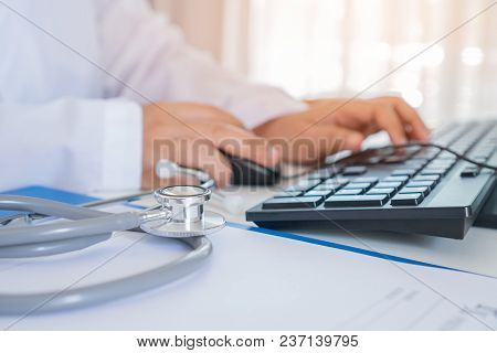 Healthcare And Medical Concept, Doctor Working Seaching Information Patient Database Through Interne