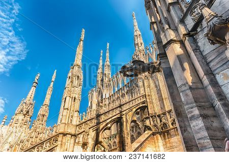 Detail With Marble Spiers And Statues On The Roof Of The Gothic Cathedral Of Milan, Italy