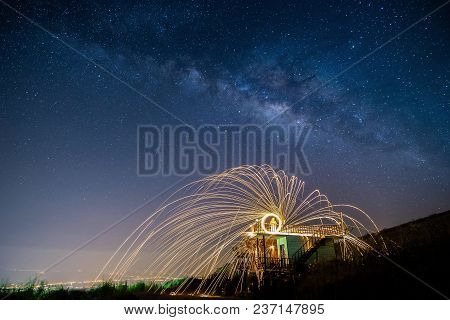 Night Landscape Mountain And Wield The Fire , Milkyway Galaxy Background , Long Exposure ,low Light