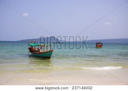 Cambodian Traditional Fishing Boat Near Koh Rohn Island Seashore. Green And Red Wooden Boat. White S
