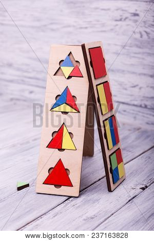 Educational Games For Children. Red, Yellow, Pink, Blue Geometrical Figures On The Wooden Background