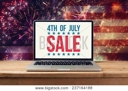 4th Of July Sale Concept With Laptop Computer Mock Up Over Fireworks Background