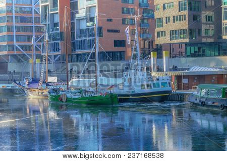 The Blue Ice On The Canal In Hafencity Hamburg.springtime In Reflections.