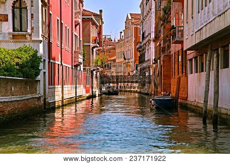 The Cast-iron Bridge Connects Opposite Sides Of The Romantic And Miniature Street Of Venice, And Und