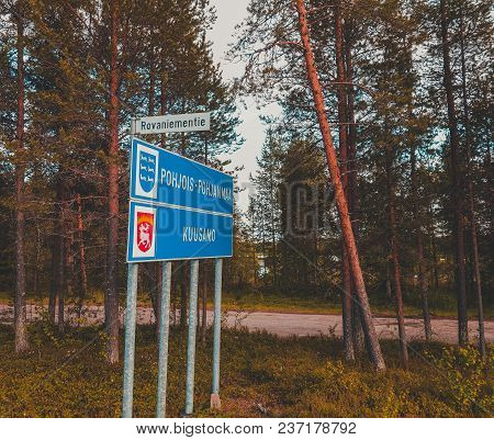Finland, Road Sign At The Side Of The Road Telling Of Entering Pohjois-pohjanmaa And Kuusamo On Rova