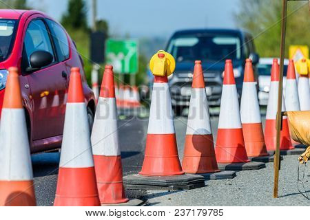 Set Of Roadworks Cones On Uk Motorway.