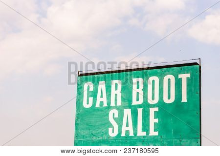 Car Boot Sale This Sunday Sign With Sky On Bachground.