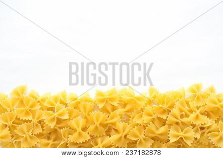 Farfalle Raw Farfallini Beautiful Decomposed Pasta With A Bottom On A White Isolated Background. Clo