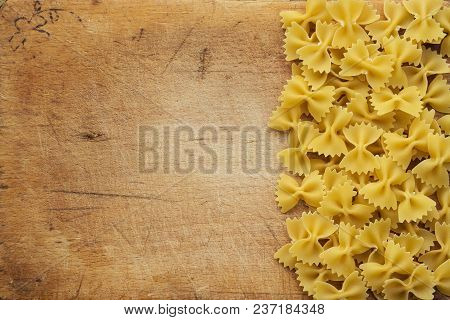 Farfalle Raw Farfallini Beautiful Laid Out Pasta With The Right, Side On A Wooden Plank Texture Back