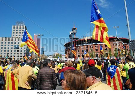 BARCELONA, SPAIN - APRIL 15, 2018: Catalans take part in the Llibertat Presos Politics (free political prisoners) protest march at Placa Espanya in support of jailed Catalan politicians.