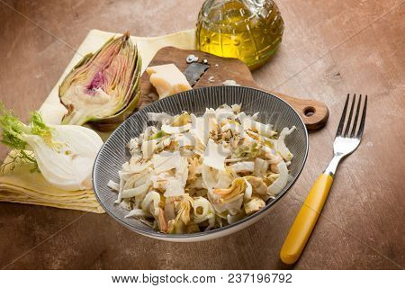 salad with artichoke, fennel, parmesan cheese flakes and fennel seeds