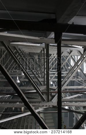 Structure Of Steel Roof Frame For Building Construction On Sky Background.