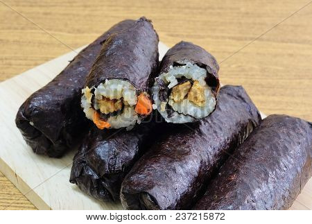 Japanese Cuisine, Traditional Vagetarian Japanese Rice Maki Sushi Roll Stuff With Tofu And Carrot Wr