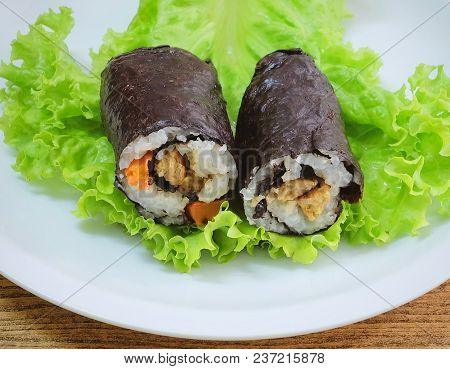 Japanese Cuisine, Traditional Vagetarian Japanese Rice Maki Sushi Roll Stuff With Tofu And Carrot Wr