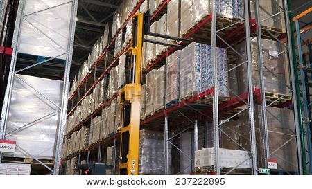Lift Truck In Factory. Clip. Wholesale Logistic, Loading, Shipment And People Concept - Man With Loa