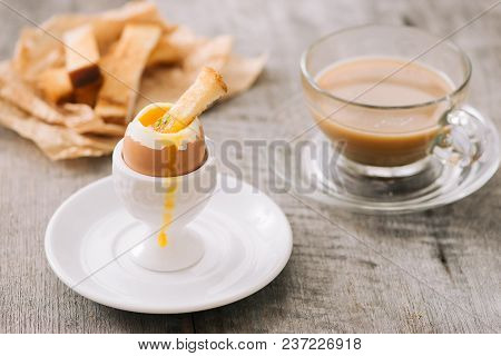 The Yolk Flows From Boiled Egg On Toast