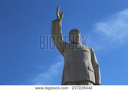 Image Of Statue Of Chairman Mao Zedong Against A Blue Sky In Lijiang, China Captured On November 28,