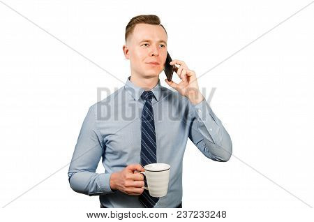 Young Businessman Dressed In Blue Shirt And Tie, Isolated On White Background