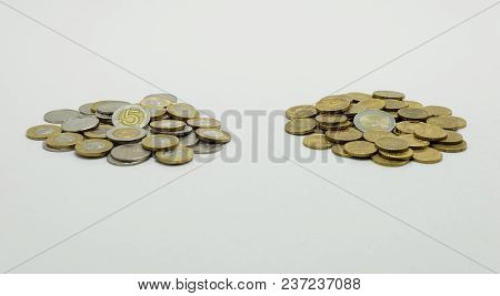 A Pile Of Coins, The Polish Currency Pln / Polish Zloty And The European Currency Euro Isolated On W